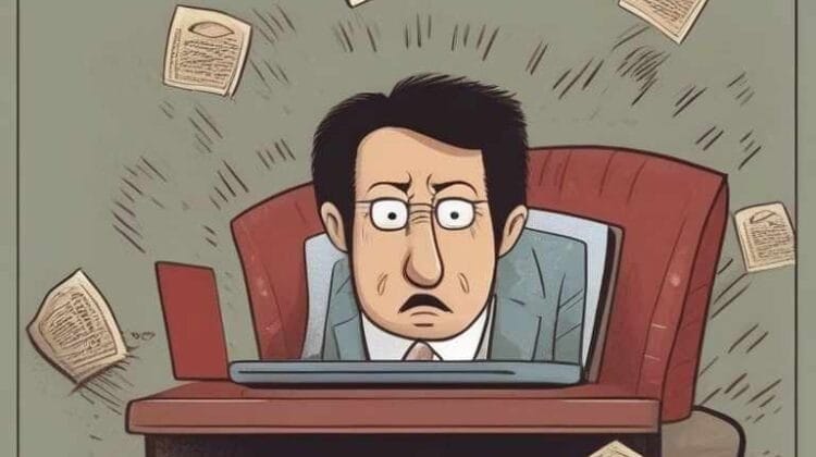 An overwhelmed man at his desk surrounded spam emails.