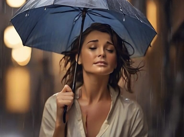 A woman holding an umbrella in the rain.